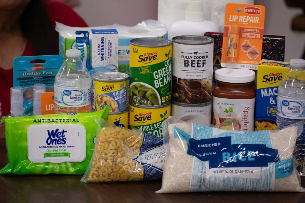 A variety of food items, toiletries, and household essentials are displayed, supporting Sioux Nation Relief Fund initiatives.